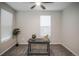 Neutral bedroom with carpet, fan, and natural light streaming in from the window at 17600 Rose Heath Ln, Parker, CO 80134