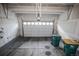 Spacious two-car garage with modern door and ample space for vehicles and storage at 17600 Rose Heath Ln, Parker, CO 80134