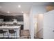 Modern kitchen featuring an island with breakfast bar and stainless steel appliances at 17600 Rose Heath Ln, Parker, CO 80134