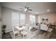 Open-concept living and dining area with hardwood floors and natural light at 17600 Rose Heath Ln, Parker, CO 80134