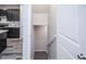 A modern staircase leading to the kitchen with sleek cabinetry at 17600 Rose Heath Ln, Parker, CO 80134