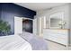 Spacious bedroom with a modern dresser and a doorway to a walk-in closet, offering ample storage at 5555 E Briarwood Ave # 1404, Centennial, CO 80122