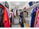 Organized walk-in closet with shelving and hanging space, providing ample storage for clothing and accessories at 5555 E Briarwood Ave # 1404, Centennial, CO 80122