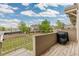 Relaxing deck view overlooking a well-maintained community, lush greenery, and open spaces at 5555 E Briarwood Ave # 1404, Centennial, CO 80122