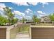 Picturesque view from a deck, showcasing the surrounding community, mature trees, and blue skies at 5555 E Briarwood Ave # 1404, Centennial, CO 80122