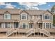 Inviting townhomes featuring private entrances, decks, and attractive landscaping, offering comfortable and stylish living at 5555 E Briarwood Ave # 1404, Centennial, CO 80122
