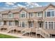 Charming townhome complex showcasing well-maintained exteriors and inviting entrances, complete with private outdoor spaces at 5555 E Briarwood Ave # 1404, Centennial, CO 80122