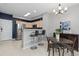 Kitchen and dining area with stainless steel appliances and bar seating at 5555 E Briarwood Ave # 1404, Centennial, CO 80122