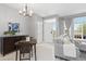 Bright living space with a dining area, large windows, and stylish furnishings, creating a comfortable atmosphere at 5555 E Briarwood Ave # 1404, Centennial, CO 80122