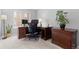 Home office with a work area, dark wood cabinets, and a large window at 5555 E Briarwood Ave # 1404, Centennial, CO 80122