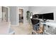 Bright office space featuring a dedicated workstation, comfortable chair, and a convenient walk-in closet at 5555 E Briarwood Ave # 1404, Centennial, CO 80122