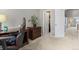 A home office space featuring a dark wood desk and chair, complemented by a large storage cabinet at 5555 E Briarwood Ave # 1404, Centennial, CO 80122