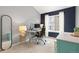 Bright office space with a modern desk setup, mirror, and a view of the window at 5555 E Briarwood Ave # 1404, Centennial, CO 80122