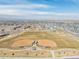 Expansive aerial perspective showing sports fields, neighborhood layout, and community amenities at 1079 Larkspur Dr, Erie, CO 80516