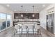 Modern kitchen featuring granite countertops, stainless steel appliances, and a breakfast bar at 1079 Larkspur Dr, Erie, CO 80516