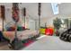 Bedroom features colorful decor, skylight, and unique furniture at 15207 W Ellsworth Pl, Golden, CO 80401