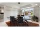 Bright dining area with large windows and a modern light fixture at 15207 W Ellsworth Pl, Golden, CO 80401