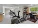 Workout room featuring an elliptical machine, stationary bike, and other fitness equipment at 15207 W Ellsworth Pl, Golden, CO 80401