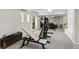 Home gym featuring workout bench, exercise equipment, and carpeted floors for a comfortable fitness space at 15207 W Ellsworth Pl, Golden, CO 80401