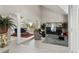 Bright and airy living room featuring high ceilings and stylish decor at 15207 W Ellsworth Pl, Golden, CO 80401