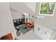 Bright living room with an orange sofa, modern furnishings, and many windows at 15207 W Ellsworth Pl, Golden, CO 80401