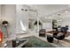 Open concept living room boasts high ceilings and plenty of natural light at 15207 W Ellsworth Pl, Golden, CO 80401