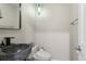 Stylish powder room featuring a unique sink and modern fixtures at 15207 W Ellsworth Pl, Golden, CO 80401