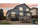 Spacious backyard featuring a large deck and outdoor dining area, perfect for entertaining guests at 15948 E 106Th Pl, Commerce City, CO 80022