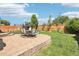 Inviting backyard with lush lawn, patio with seating, and privacy fence at 15948 E 106Th Pl, Commerce City, CO 80022