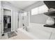 Beautiful bathroom with a soaking tub and glass enclosed shower at 15948 E 106Th Pl, Commerce City, CO 80022
