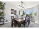 Elegant dining room with ample seating, natural light, and stylish décor, perfect for hosting gatherings at 15948 E 106Th Pl, Commerce City, CO 80022