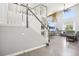 A bright and welcoming entryway leading to a spacious living area with hardwood floors and large windows at 15948 E 106Th Pl, Commerce City, CO 80022