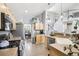 Spacious kitchen with stainless steel appliances, eat-in dining, and hardwood floors at 15948 E 106Th Pl, Commerce City, CO 80022