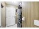 Convenient laundry room featuring a stacked washer and dryer and neutral paint at 15948 E 106Th Pl, Commerce City, CO 80022