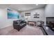 Finished basement featuring stylish seating, decor, and space for musical activities at 21502 E Idyllwilde Dr, Parker, CO 80138