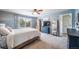 Comfortable bedroom with a ceiling fan, large window, and natural light at 21502 E Idyllwilde Dr, Parker, CO 80138