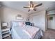 Comfortable bedroom with ceiling fan, closet, and complementary furnishings and decor at 21502 E Idyllwilde Dr, Parker, CO 80138