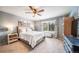 Inviting bedroom with neutral colors, a large window, and comfortable furniture at 21502 E Idyllwilde Dr, Parker, CO 80138