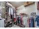 Walk-in closet with ample storage, shelving, and hanging space for clothing at 21502 E Idyllwilde Dr, Parker, CO 80138