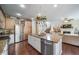 Stylish kitchen with a granite island, stainless steel appliances, and hardwood floors at 21502 E Idyllwilde Dr, Parker, CO 80138