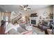 Inviting living room with a fireplace, built-in shelving, and comfortable seating at 21502 E Idyllwilde Dr, Parker, CO 80138