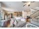 Open-concept living space with hardwood floors, comfortable sofas, and adjacent dining area at 21502 E Idyllwilde Dr, Parker, CO 80138