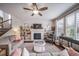 Cozy living room featuring a fireplace with built-in shelving and comfortable seating at 21502 E Idyllwilde Dr, Parker, CO 80138