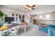 Bright upstairs loft area offers a comfortable workspace and seating with a view of the staircase at 21502 E Idyllwilde Dr, Parker, CO 80138