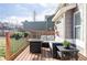 Back deck featuring outdoor seating area with comfortable cushions and a fire table at 4128 S Riviera St, Aurora, CO 80018