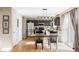 Inviting kitchen and dining area with modern light fixtures and stainless steel appliances at 4128 S Riviera St, Aurora, CO 80018