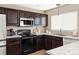 Well-maintained kitchen featuring modern appliances and ample counter space at 4128 S Riviera St, Aurora, CO 80018