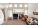 Bright living room boasting a fireplace and an abundance of natural light at 4128 S Riviera St, Aurora, CO 80018
