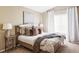 Serene bedroom with neutral tones, natural light and comfortable furnishings at 4128 S Riviera St, Aurora, CO 80018