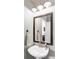 Clean powder room featuring a modern sink and vanity with elegant mirror at 4128 S Riviera St, Aurora, CO 80018